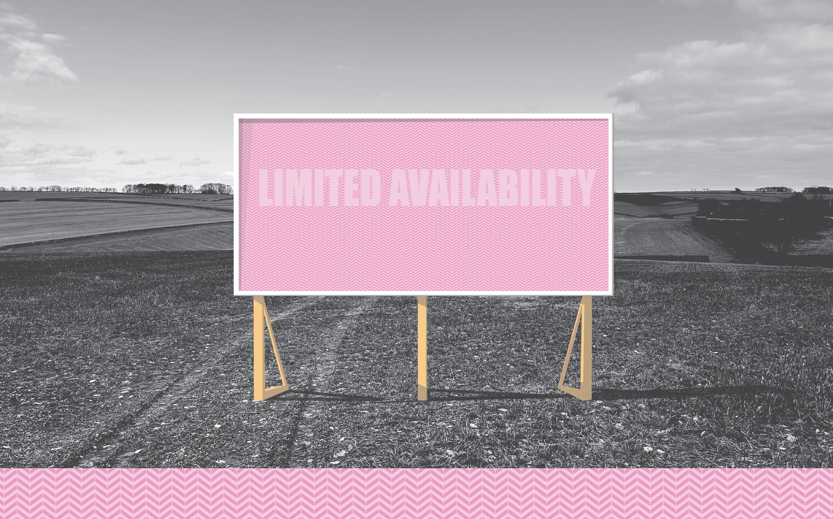 A pink billborad stands in an agricultural field, it says 'Limited Availability'.
